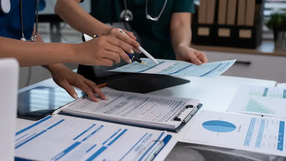 medical quality team looking over documents