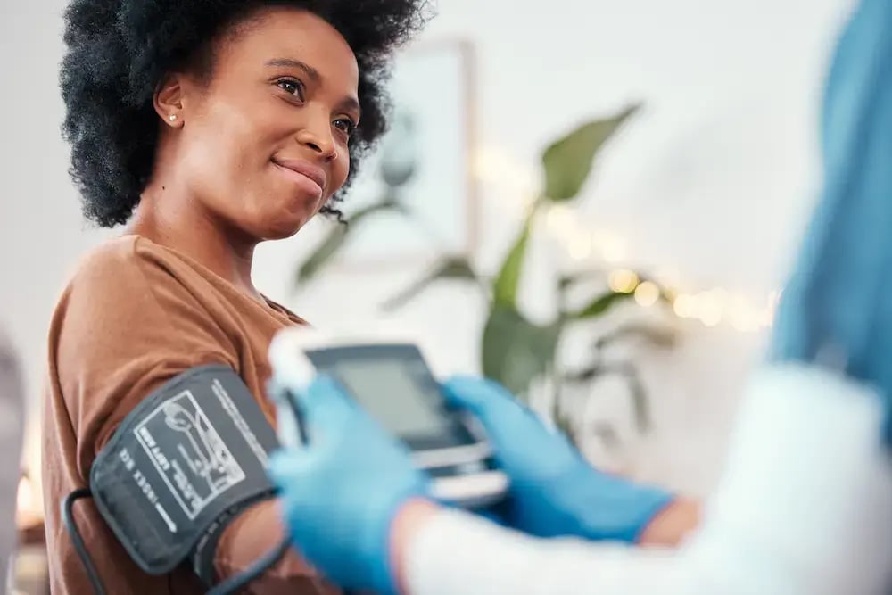 patient using a medical device with a professional
