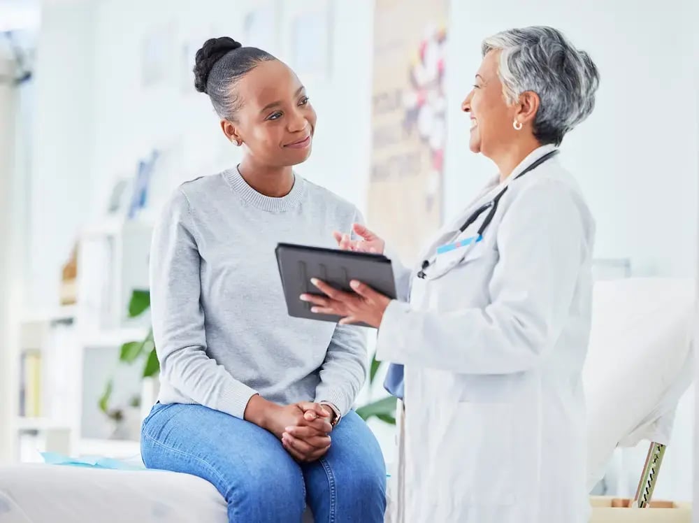 doctor helping a patient