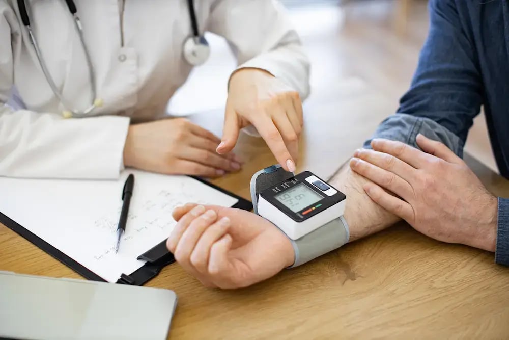 doctor helping patient with new medical device