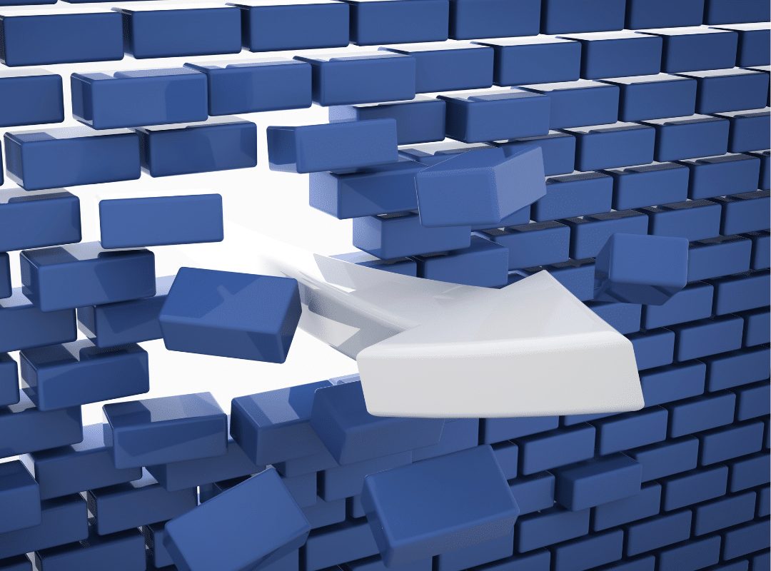 arrow breaking through blue brick wall