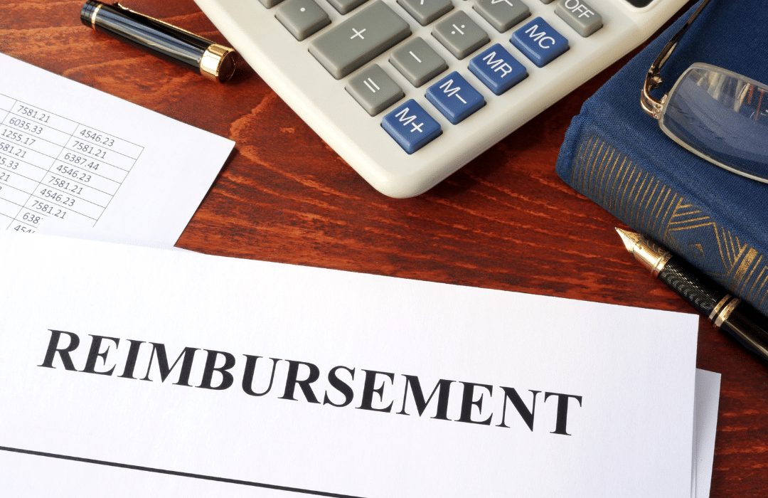 reimbursement paper next to calculator