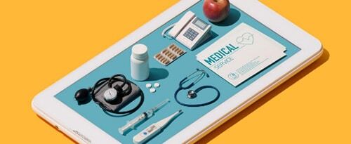 tablet with medical items on top