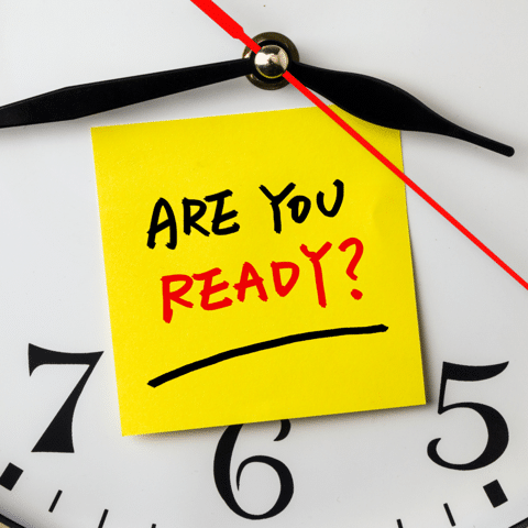 sticky note saying are you ready on top of a clock
