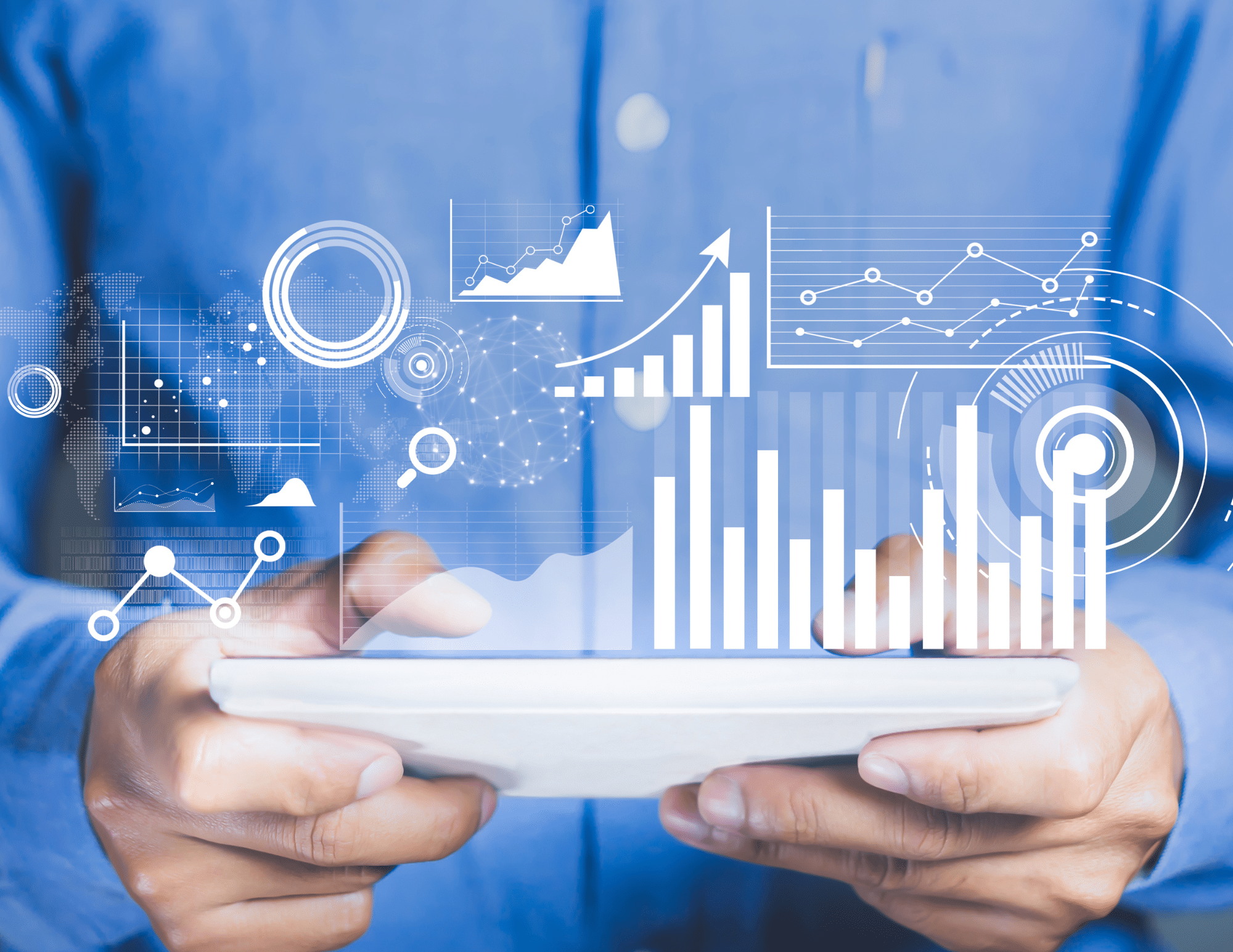 person holding tablet with charts hovering over it