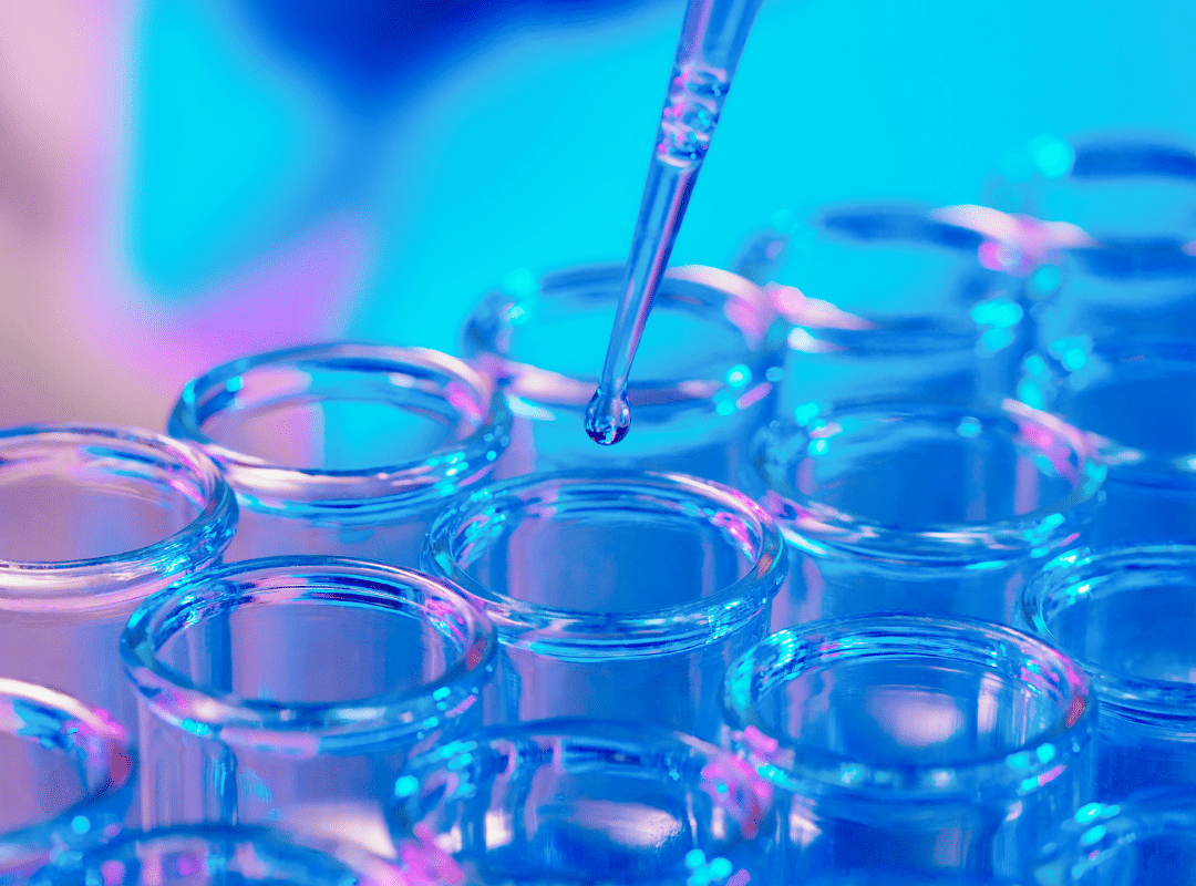 dropper adding to rows of test tubes