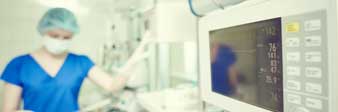 medical professional next to device