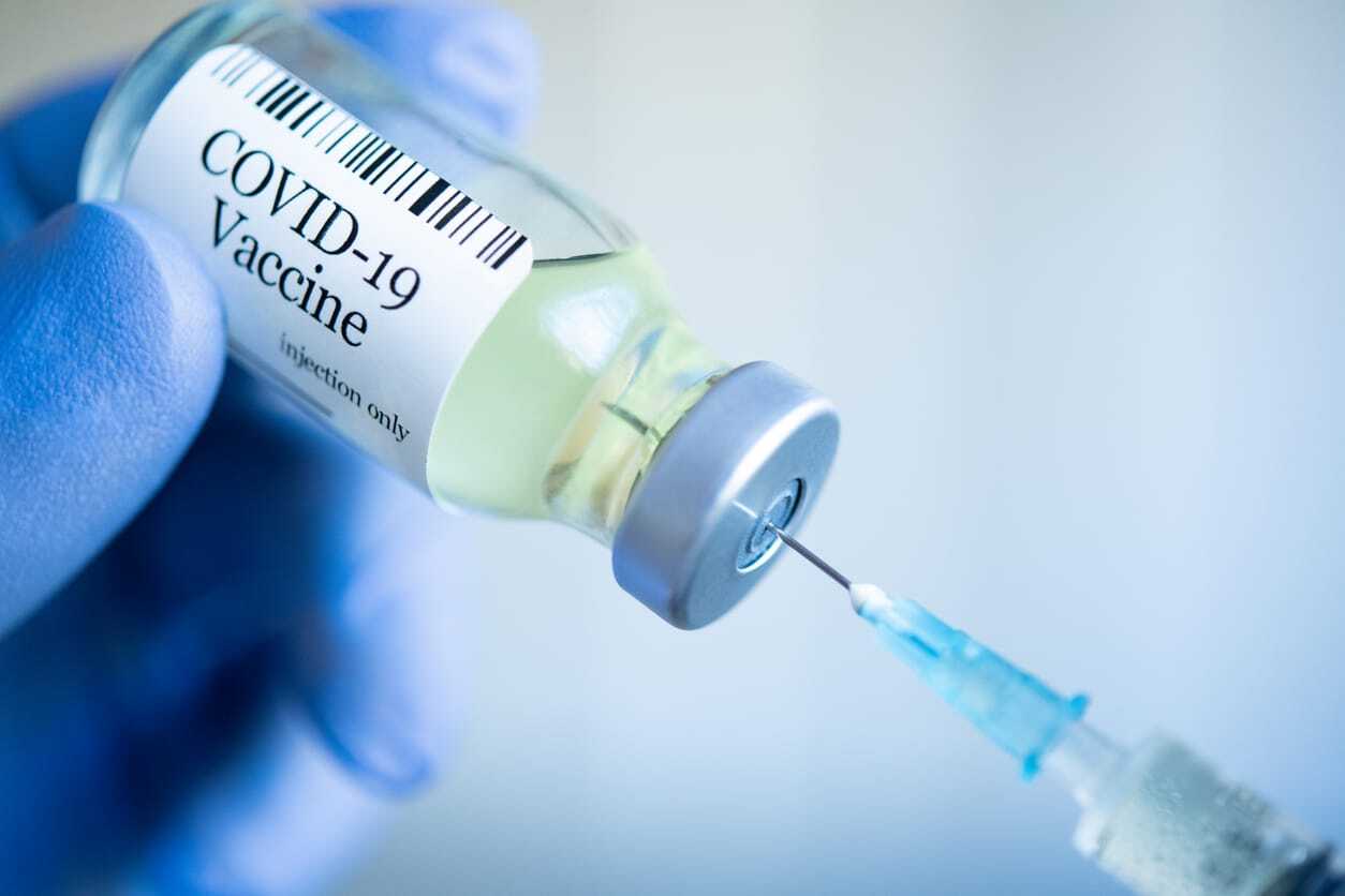 injection dose being pulled for covid-19 vaccine
